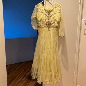 Baby yellow chudiar with stone work  matching net duppatta and tights